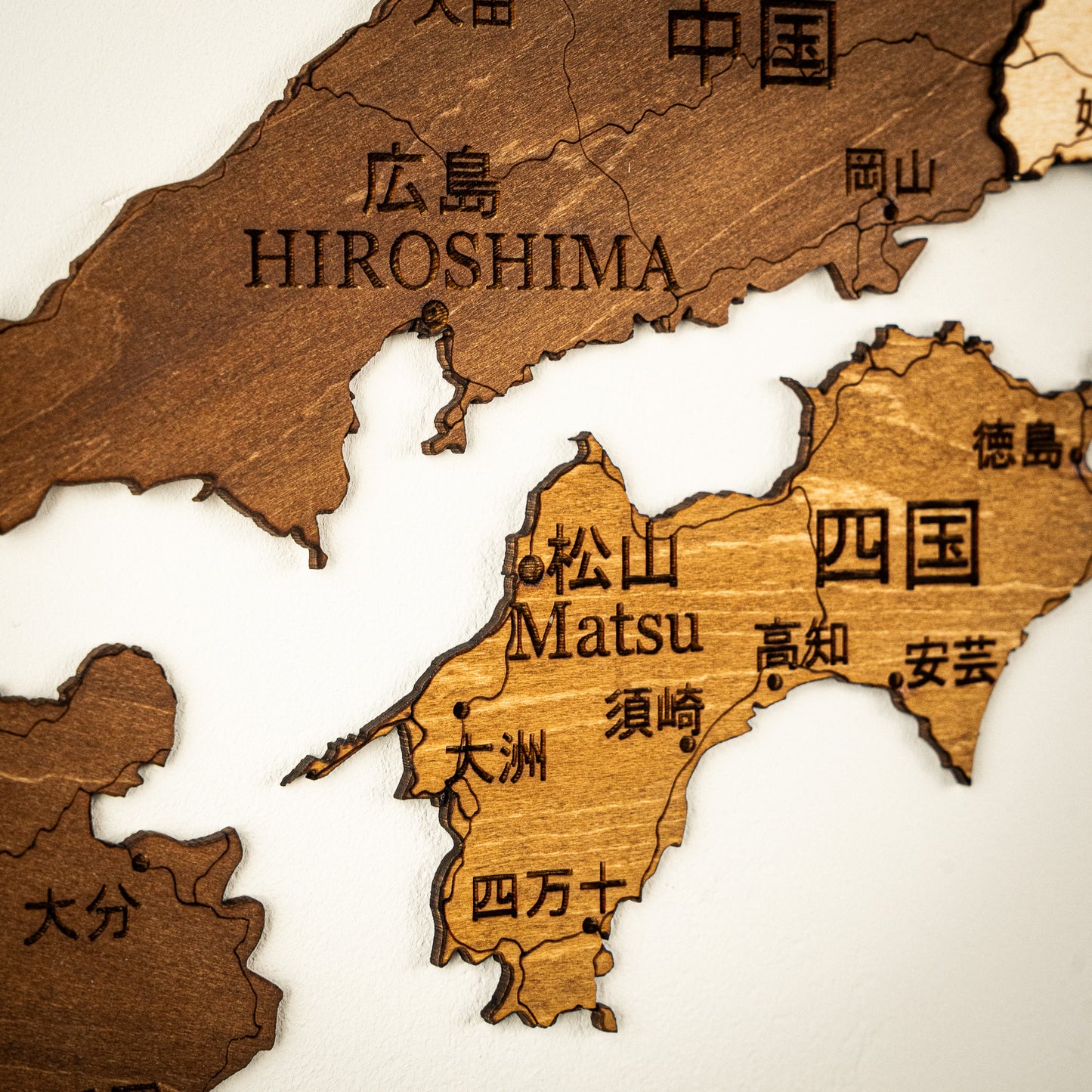 Wooden map of Japan with Hiroshima and Matsu labeled