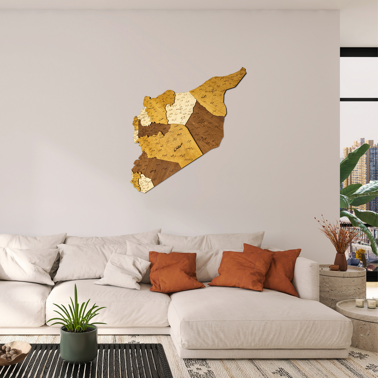 Decorative 3D Wooden map of Syria in a living room setting with a sofa and plants.