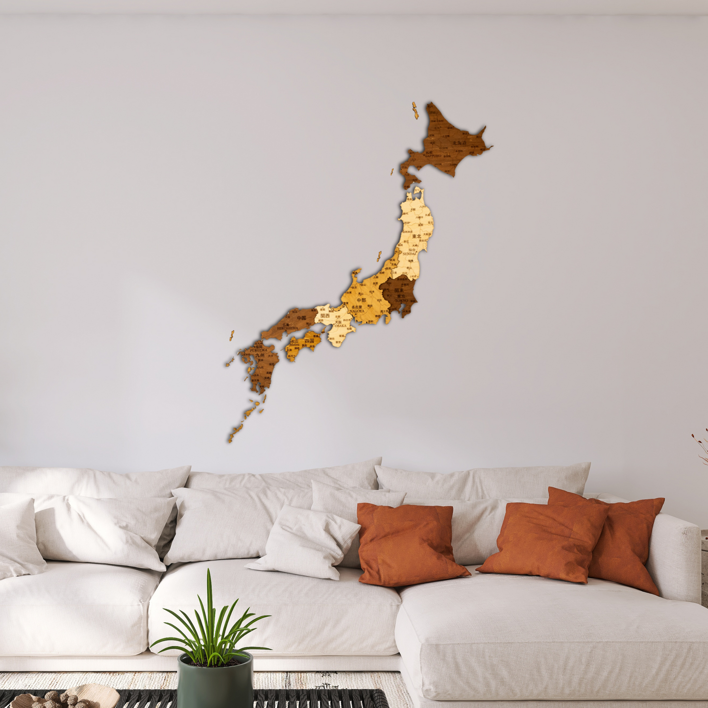 Wooden wall decoration of Japan in a living room with a white sofa and orange cushions.