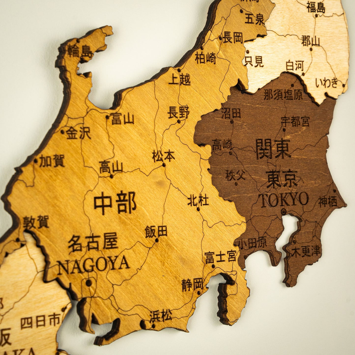 Wooden map of Japan with major cities labeled