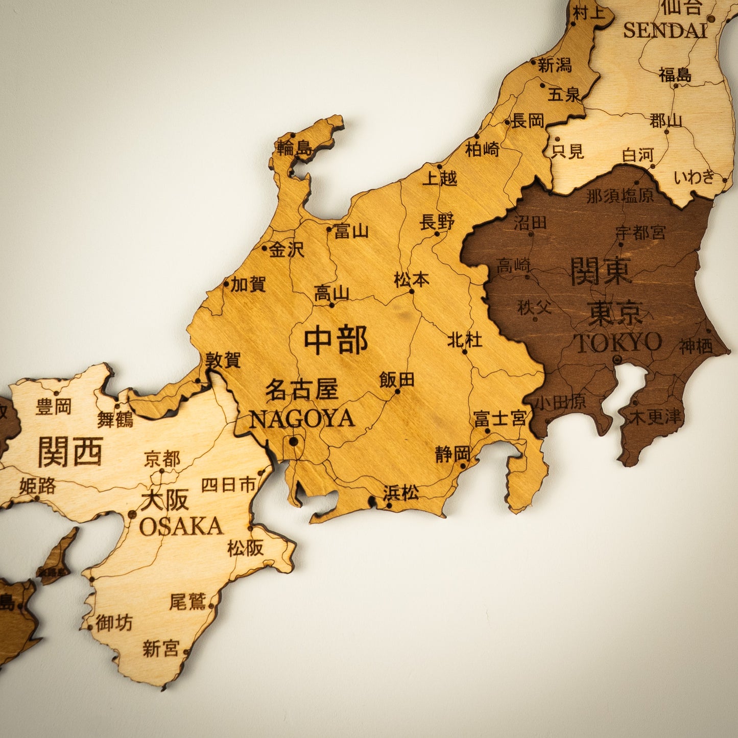 Wooden map of Japan with major cities labeled
