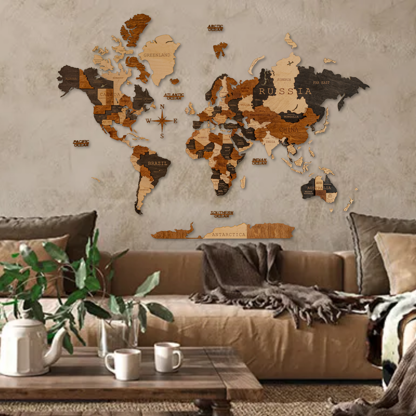 Living room with a world map on the wall and a brown sofa.