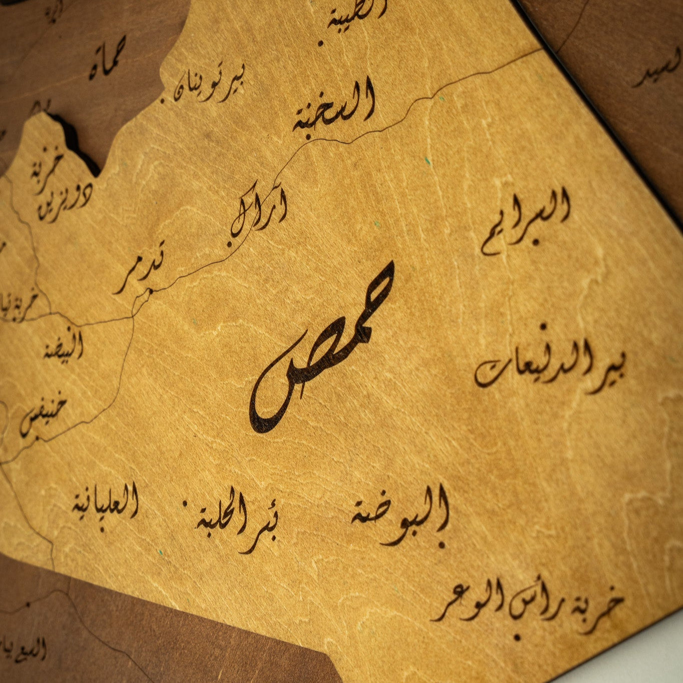 Map of Syria with Arabic text on a brown background