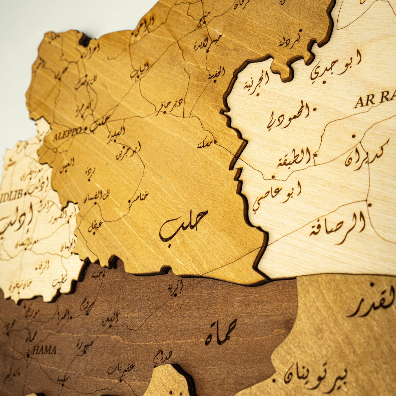 Wooden map of Syria with Arabic text