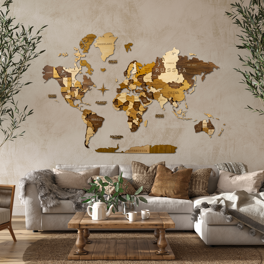 A 3D wooden world map with different shades of brown tones, mounted on a wall above a beige sofa with cushions. The map features detailed country outlines and a compass rose.