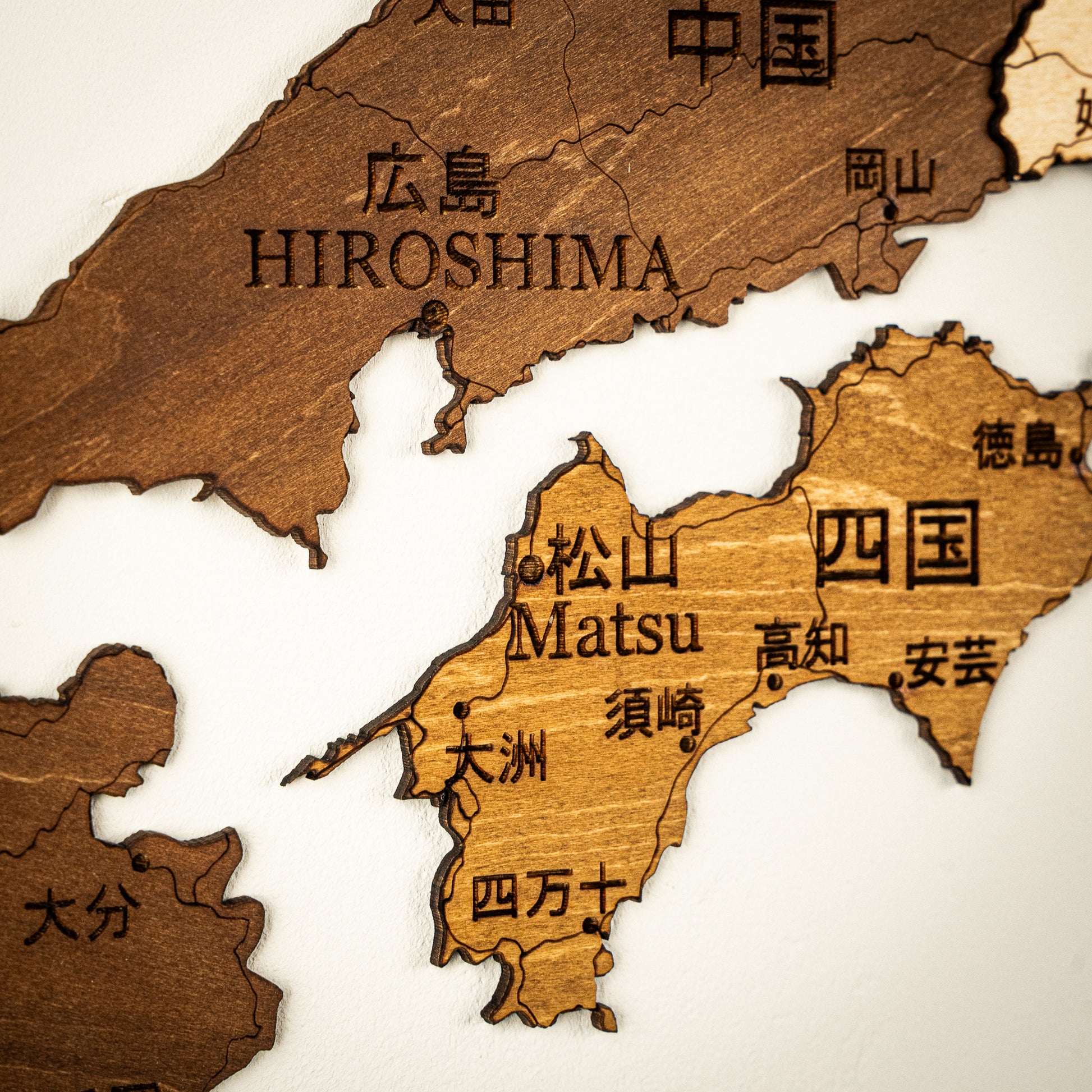 Wooden map of Japan with Hiroshima and Matsu labeled