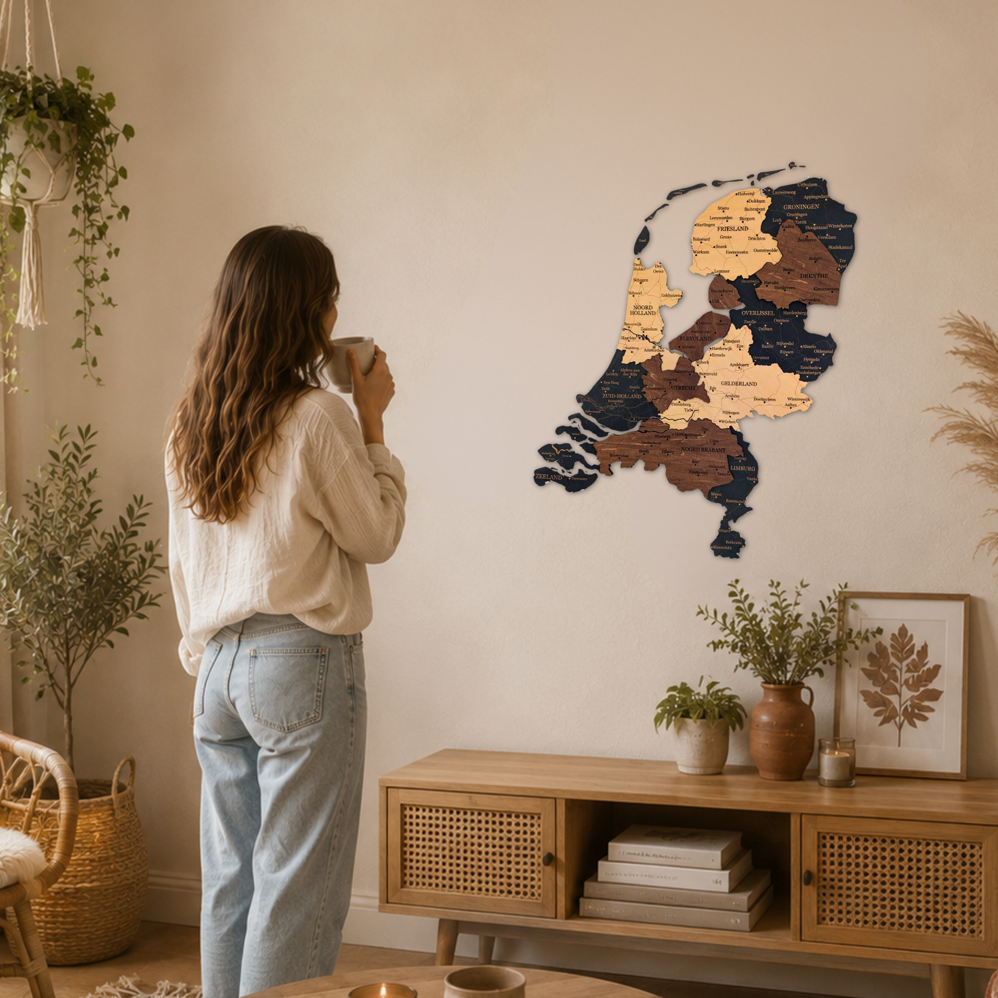 Woman standing in a cozy living room looking at a wooden wall map of netherlands.