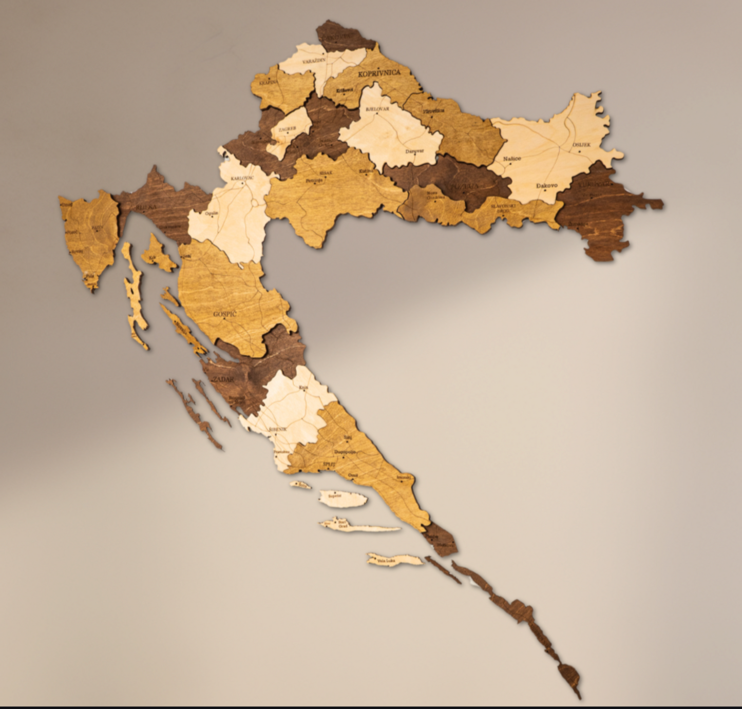 Wooden map of Croatia on a beige background