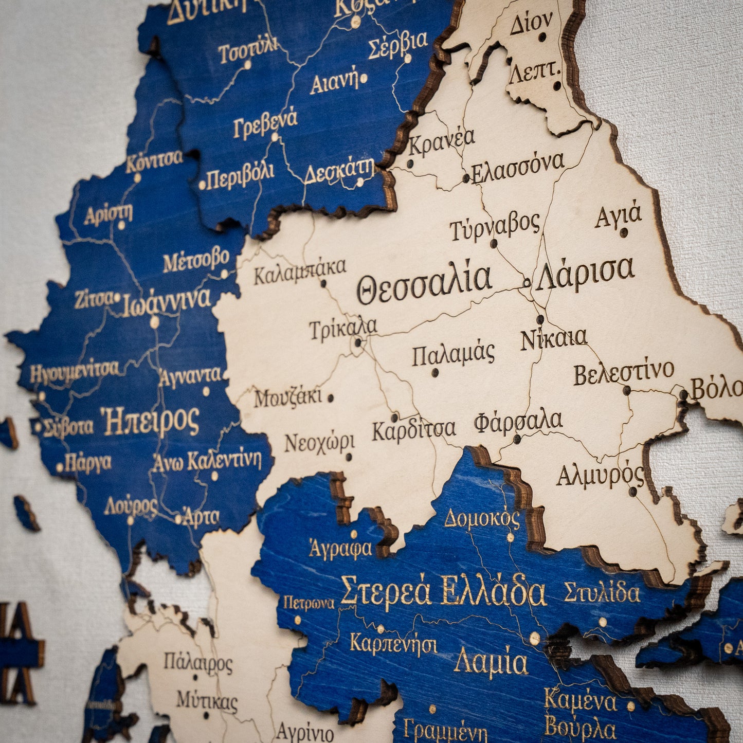 Wooden map of Greece with blue and white colors