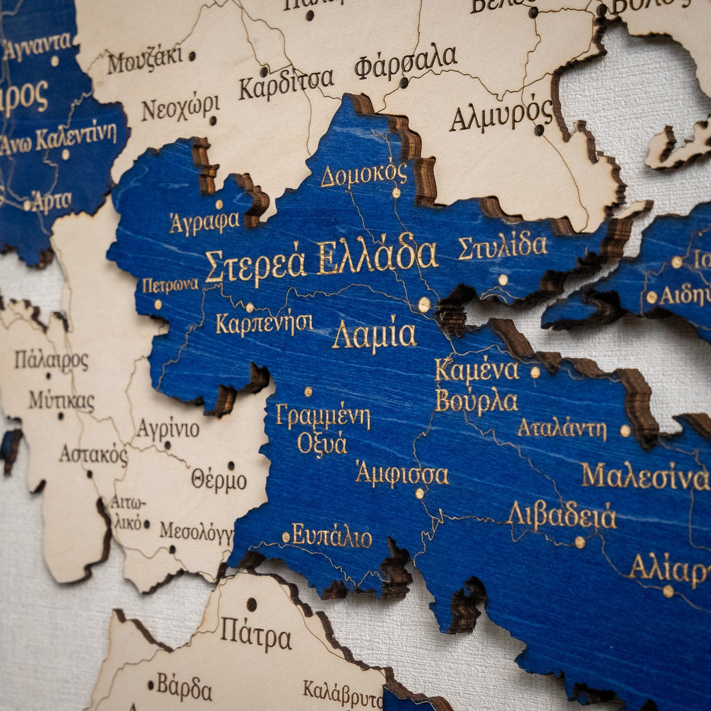 Wooden map of Greece with blue colors