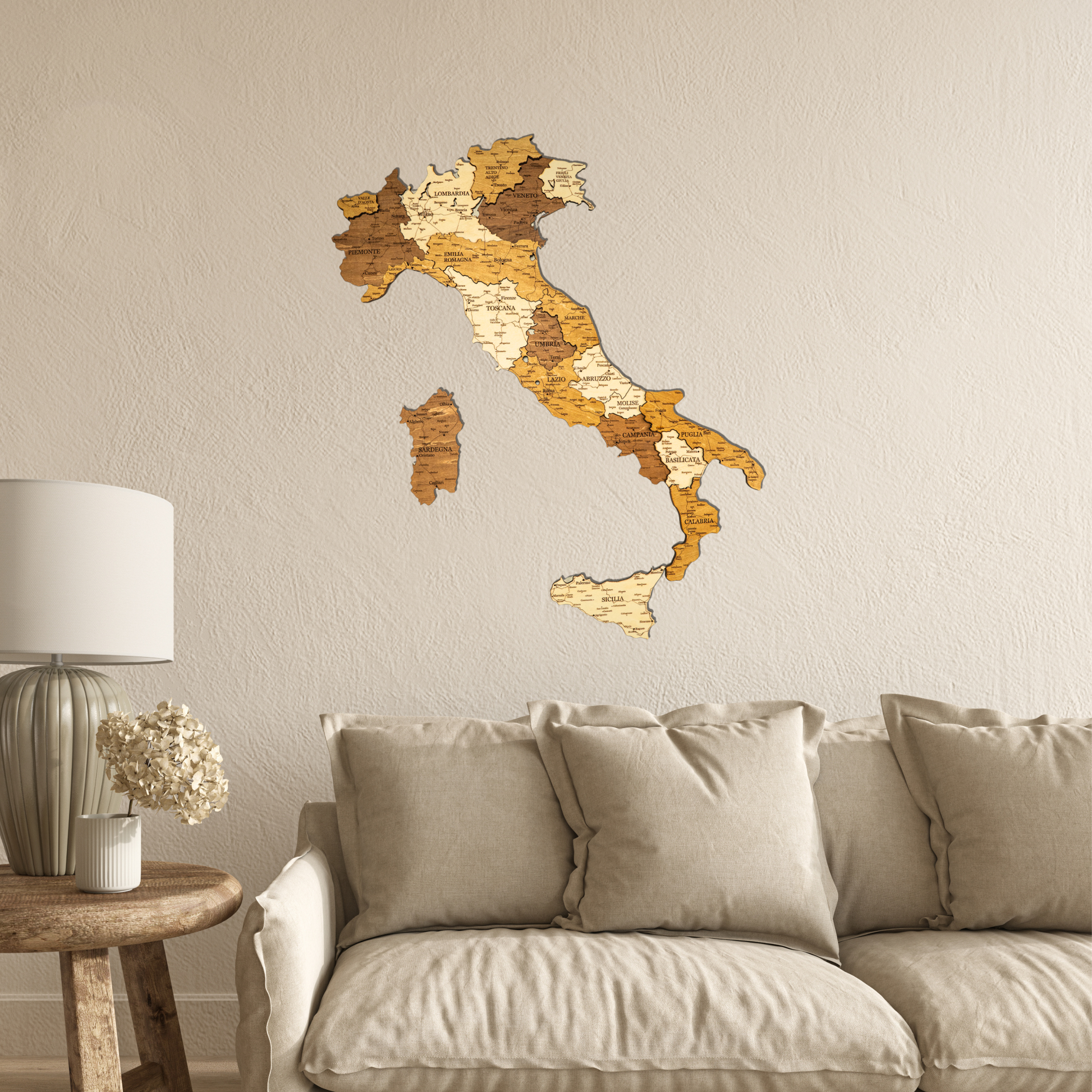 Wooden map of Italy on a wall above a beige sofa in a living room.
