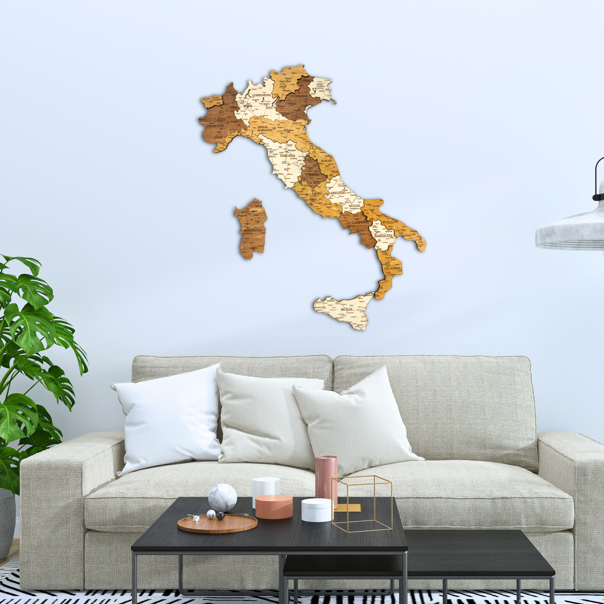 Wooden map of Italy on a wall above a living room with a sofa and coffee table.