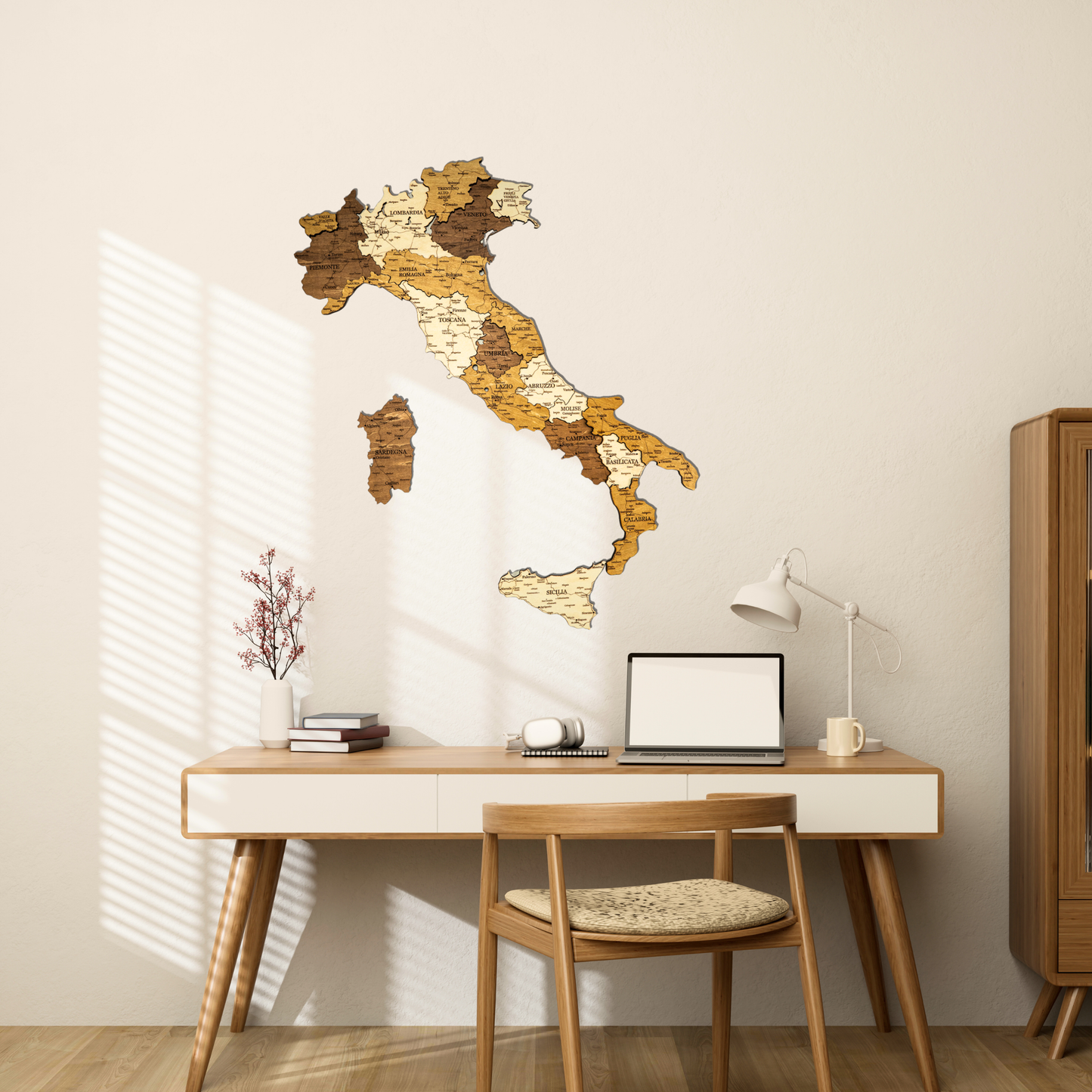 Wooden wall map of Italy in a home office setting with a desk and chair.
