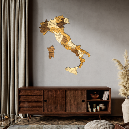 Wooden wall map of Italy on a gray wall above a wooden cabinet.